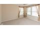 Well-lit bedroom features neutral carpet, base trim, and window treatments at 5344 Misthaven Ln, Greenwood, IN 46143
