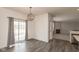 Bright dining area features a decorative chandelier and sliding glass doors at 5344 Misthaven Ln, Greenwood, IN 46143