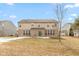 The rear exterior of a two-story home with a brick first floor and vinyl siding at 5344 Misthaven Ln, Greenwood, IN 46143
