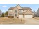 Charming two-story home with brick facade, two-car garage, and well-maintained lawn at 5344 Misthaven Ln, Greenwood, IN 46143