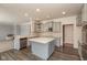 Stylish kitchen features gray cabinetry, stainless steel appliances, a central island, and elegant quartz countertops at 5344 Misthaven Ln, Greenwood, IN 46143