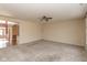 Open living room featuring plush carpet and a ceiling fan at 5344 Misthaven Ln, Greenwood, IN 46143