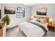 Cozy bedroom featuring natural light, neutral decor, and minimalist furnishings at 5721 Rosemont Ct, Indianapolis, IN 46254