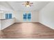 Spacious living room featuring hardwood floors, and a large window at 5721 Rosemont Ct, Indianapolis, IN 46254