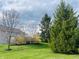 Spacious backyard with mature trees and lush greenery, perfect for outdoor enjoyment at 5769 Marsh Glen Ct, Carmel, IN 46033