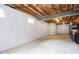 Spacious unfinished basement with concrete floor and exposed ceiling beams at 5769 Marsh Glen Ct, Carmel, IN 46033