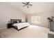 Spacious bedroom with vaulted ceiling, large bed, and plenty of natural light at 5769 Marsh Glen Ct, Carmel, IN 46033