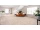 Bright and airy bonus room featuring stylish seating and plenty of open space at 5769 Marsh Glen Ct, Carmel, IN 46033