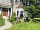 Brick home with a manicured front yard with a bay window and walkway at 5769 Marsh Glen Ct, Carmel, IN 46033