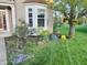 Charming front yard featuring colorful flowers and a bay window, creating a warm welcome at 5769 Marsh Glen Ct, Carmel, IN 46033