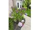 Inviting landscaping featuring a lilac bush and curved walkway, enhancing curb appeal at 5769 Marsh Glen Ct, Carmel, IN 46033