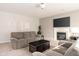 Bright living room features a fireplace, neutral color scheme, and plush seating at 5769 Marsh Glen Ct, Carmel, IN 46033