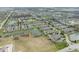 Expansive aerial view of a community with ponds, green spaces, and well-arranged townhomes at 6014 Wildcat Dr, Indianapolis, IN 46203