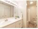 Bright bathroom featuring double sinks, large mirror and shower-tub combo with neutral tones at 6014 Wildcat Dr, Indianapolis, IN 46203