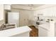 Functional kitchen featuring white cabinetry, laminate countertops, and matching appliances at 6014 Wildcat Dr, Indianapolis, IN 46203