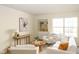 Bright living room showcasing stylish furnishings, a built-in shelf, and lots of natural light at 6014 Wildcat Dr, Indianapolis, IN 46203