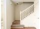 Clean staircase featuring carpeted stairs, a white railing, and access to the upper level at 6014 Wildcat Dr, Indianapolis, IN 46203