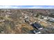 Aerial view of the property showcasing the neighborhood and surrounding trees at 6470 Jackson St, Indianapolis, IN 46241