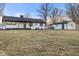 Back of house with a large backyard and detached shed at 6470 Jackson St, Indianapolis, IN 46241