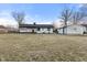 Back of house with a large backyard and detached shed at 6470 Jackson St, Indianapolis, IN 46241