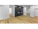 Finished basement featuring a modern fireplace, and wood look floors at 6470 Jackson St, Indianapolis, IN 46241