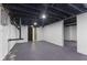 Spacious unfinished basement with concrete floors, white walls, and dark ceiling at 6470 Jackson St, Indianapolis, IN 46241