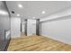 Finished basement featuring recessed lighting, wood look floors, and large rooms at 6470 Jackson St, Indianapolis, IN 46241