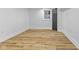 Finished basement featuring wood look floors, and bright light at 6470 Jackson St, Indianapolis, IN 46241