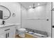 Modern bathroom with a glass-enclosed shower, sleek vanity, and black and white accents at 6470 Jackson St, Indianapolis, IN 46241