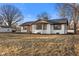 Inviting single-Gathering home displaying updated exterior features, a landscaped yard, and a welcoming curb appeal at 6470 Jackson St, Indianapolis, IN 46241