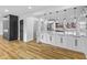 Modern open kitchen with a large island, stainless steel appliances, and seamless integration with the living area at 6470 Jackson St, Indianapolis, IN 46241