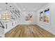 Stylish kitchen boasting white cabinets, sleek countertops, and modern lighting fixtures with natural light at 6470 Jackson St, Indianapolis, IN 46241