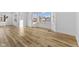 Bright living room with wood-look floors and a large bay window offering ample natural light at 6470 Jackson St, Indianapolis, IN 46241