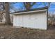 Outdoor view of the shed in backyard with double door, and a window at 6470 Jackson St, Indianapolis, IN 46241