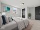 Bedroom with gray walls, plush carpet, window, and door to adjoining room or closet at 718 Indiana Ave, Shelbyville, IN 46176