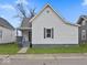 Charming exterior showcasing the home's architectural details, including the siding, roof, and covered front porch at 718 Indiana Ave, Shelbyville, IN 46176