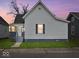 Charming exterior showcasing the home's architectural details, including the siding, roof, and covered front porch at 718 Indiana Ave, Shelbyville, IN 46176
