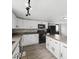 Modern kitchen featuring white cabinets, modern appliances, and countertops at 718 Indiana Ave, Shelbyville, IN 46176