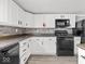 Modern kitchen featuring white cabinets, modern appliances, and countertops at 718 Indiana Ave, Shelbyville, IN 46176