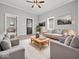 Inviting living room with neutral paint, carpet, and an abundance of natural light creating a warm and welcoming atmosphere at 718 Indiana Ave, Shelbyville, IN 46176