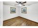 Bright bedroom with hardwood floors and two windows offering natural light at 719 Howard Rd, Greenwood, IN 46142
