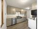 Updated kitchen with stainless steel appliances, modern cabinets, and a farmhouse sink at 719 Howard Rd, Greenwood, IN 46142