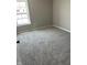 Bedroom featuring soft carpet, neutral walls, and a bright window, filling the room with light at 764 Oakleaf Dr, Greenfield, IN 46140