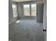 Bedroom with plush carpet, natural light from the three pane windows, and a neutral color palette at 764 Oakleaf Dr, Greenfield, IN 46140