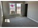 Bedroom with gray carpet, neutral walls, and a bright window, great natural light at 764 Oakleaf Dr, Greenfield, IN 46140