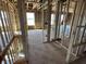 Unfinished staircase with wooden framing, leading to the second floor, showcasing the home's layout at 764 Oakleaf Dr, Greenfield, IN 46140