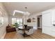 Dining and Living room combo featuring hardwood floors and natural light from a large window at 802 N Meridian St # 205, Indianapolis, IN 46204
