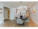 Kitchen, dining area, and living room feature an open concept with hardwood floors and modern decor at 802 N Meridian St # 205, Indianapolis, IN 46204
