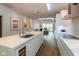Bright modern kitchen with an island and wine cooler that flows seamlessly into the living area at 802 N Meridian St # 205, Indianapolis, IN 46204