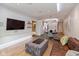 Modern living area with hardwood floors, sleek furniture, and views into the dining and kitchen areas at 802 N Meridian St # 205, Indianapolis, IN 46204